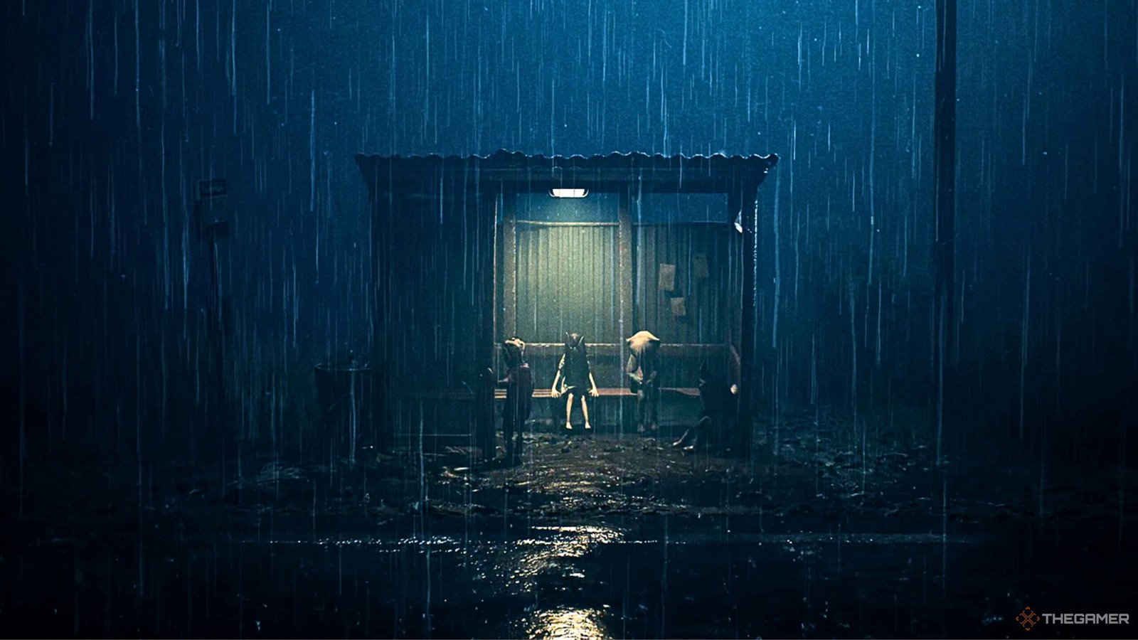 Close-up of a high-end gaming setup featuring a PS5, Xbox Series X, and Nintendo Switch 2 dock side-by-side on a minimalist desk.