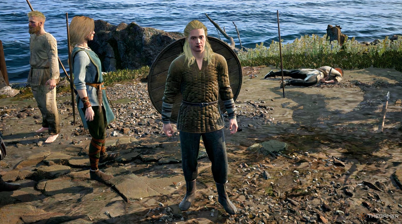 A high-end gaming PC setup with glowing RGB lights next to a PS5 console, showing a blurred Grand Theft Auto VI loading screen.