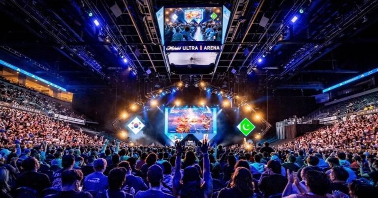 Crowded esports arena in Las Vegas with players competing on PS5 consoles during a high-stakes fighting game tournament.