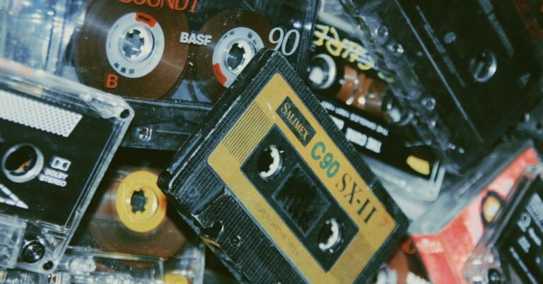 A high-tech gaming setup featuring a glowing mechanical keyboard and a controller resting beside a vintage arcade stick, symbolizing the bridge between retro franchises and modern 2026 hardware.